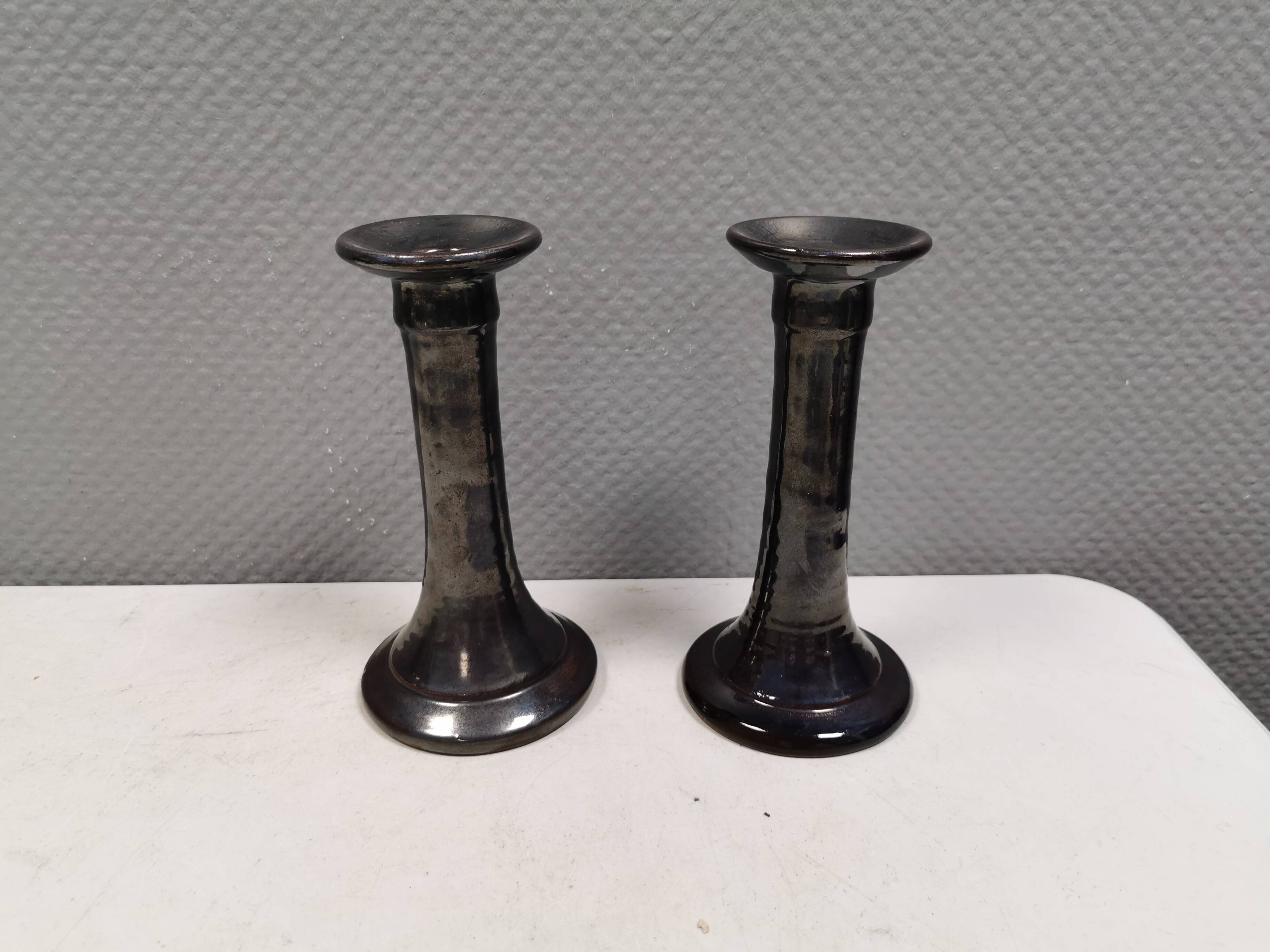 A set of ceramic candlesticks in bluish metallic glaze, Denmark 1980s
