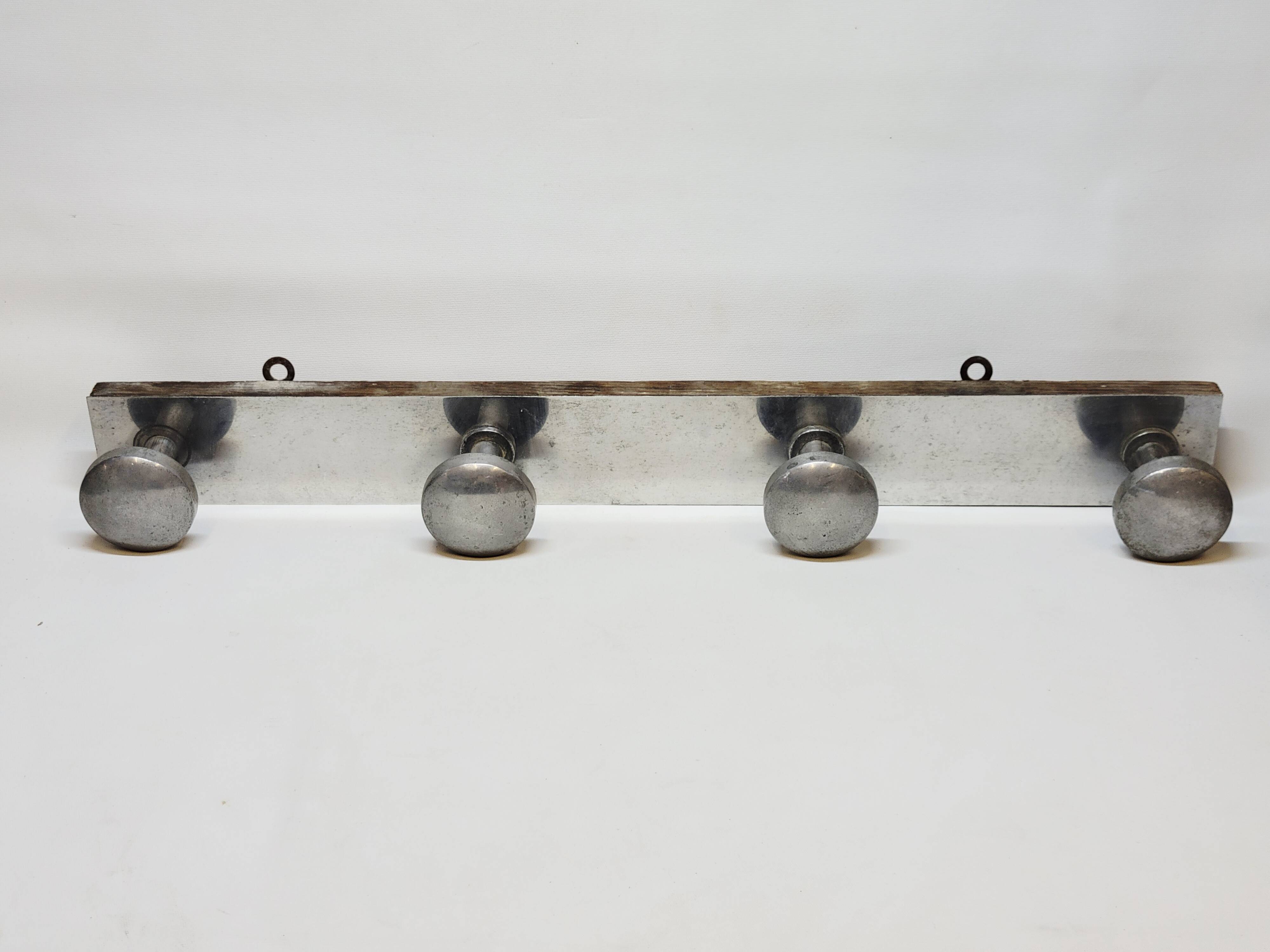 Retro vintage coat rack with 4 aluminum hooks on a wooden frame