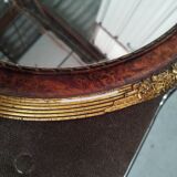 Golden oval art deco mirror