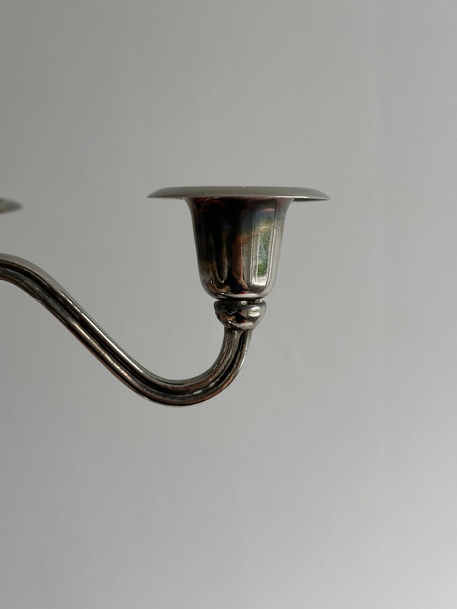 Candlestick candle holder in patinated silver metal