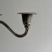 Candlestick candle holder in patinated silver metal