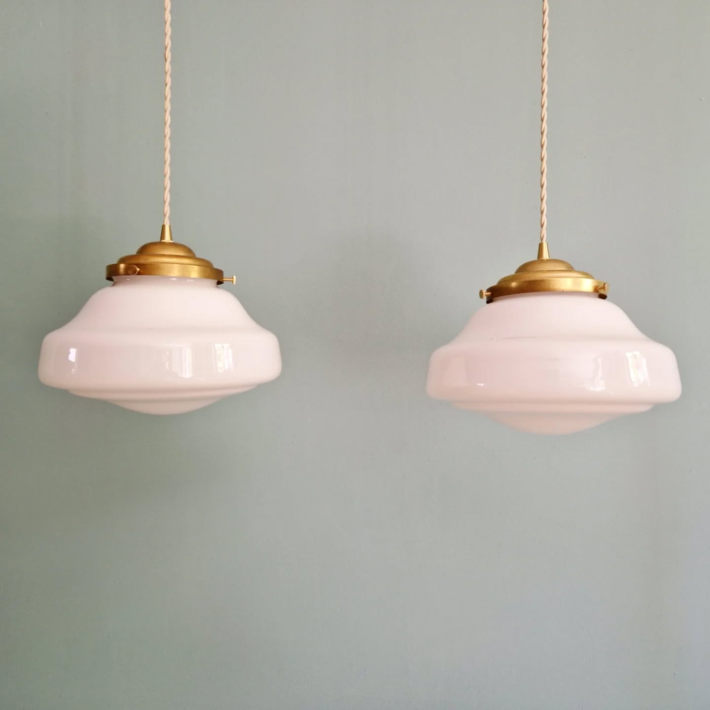 Pair of Art Deco pendant lights in white opaline.