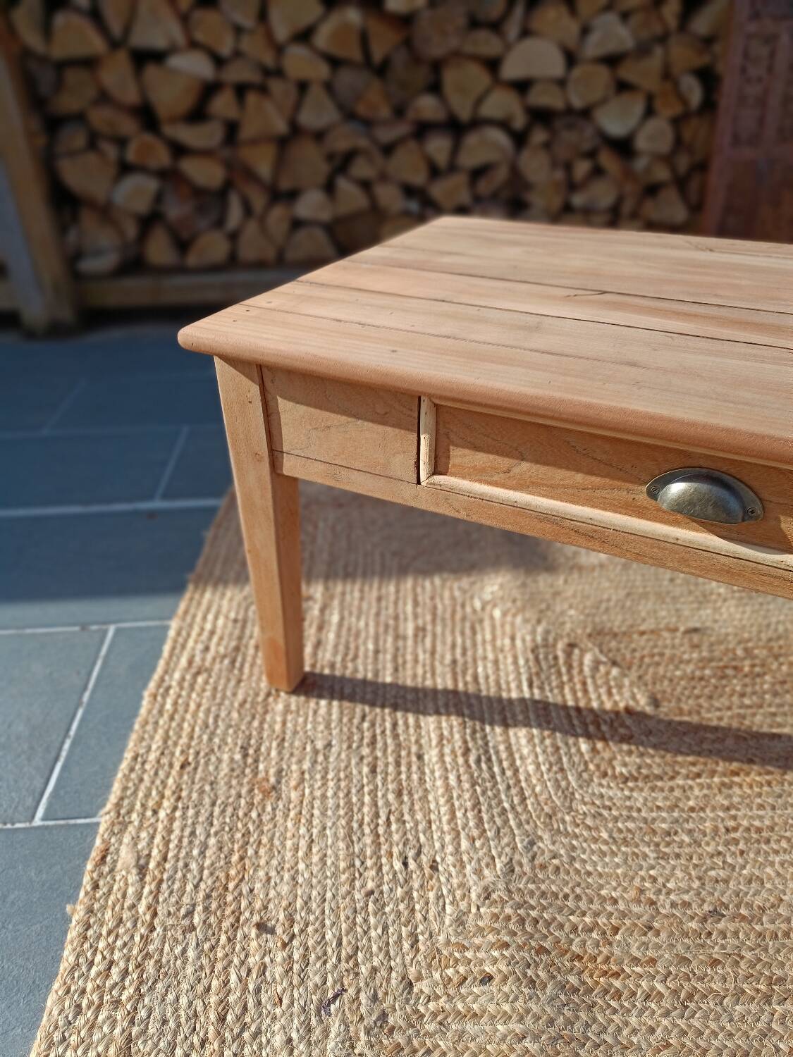 Low farmhouse table in raw wood