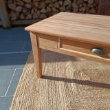 Low farmhouse table in raw wood