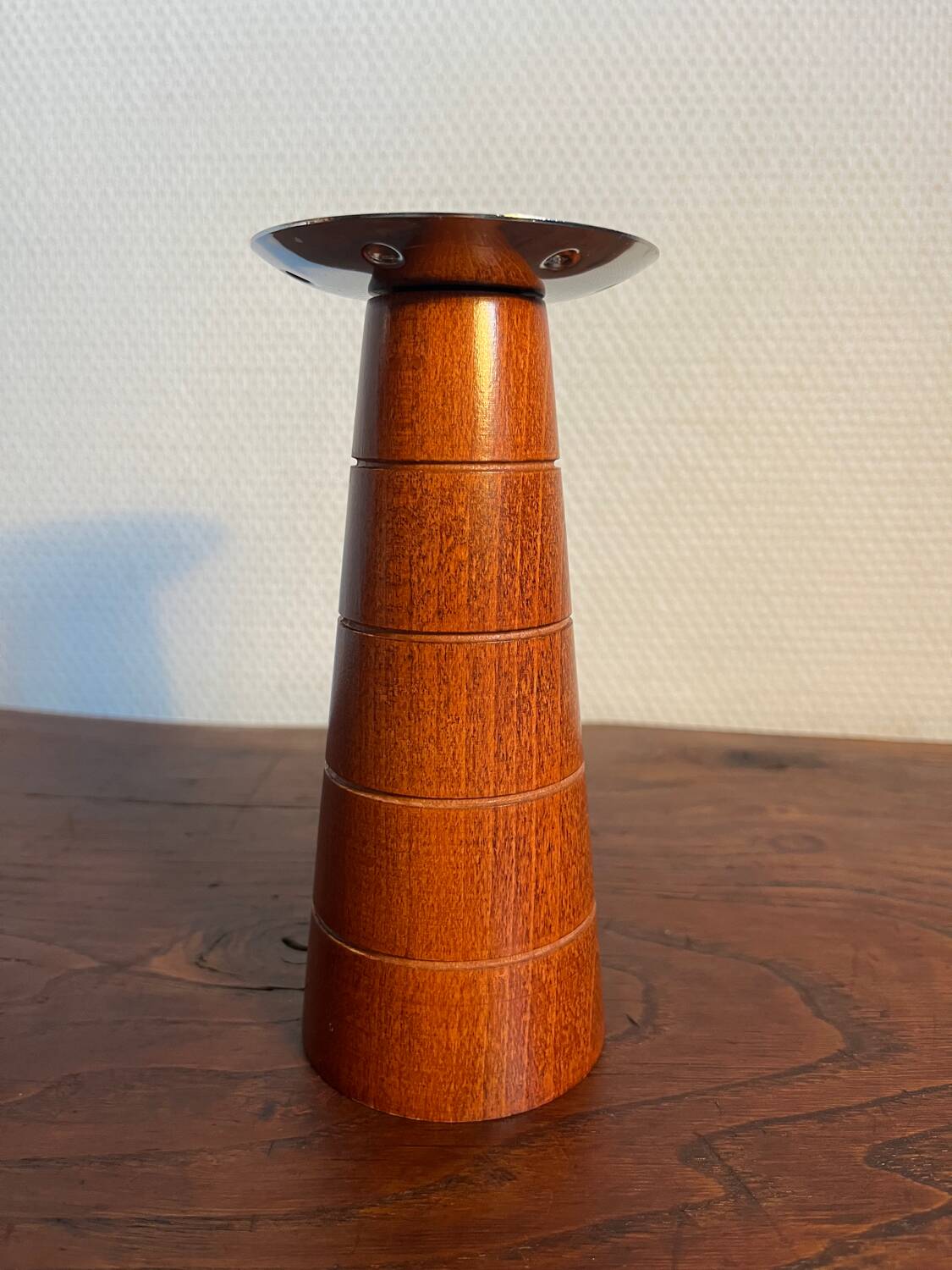 Pair of Guy Degrenne wooden and stainless steel candlesticks