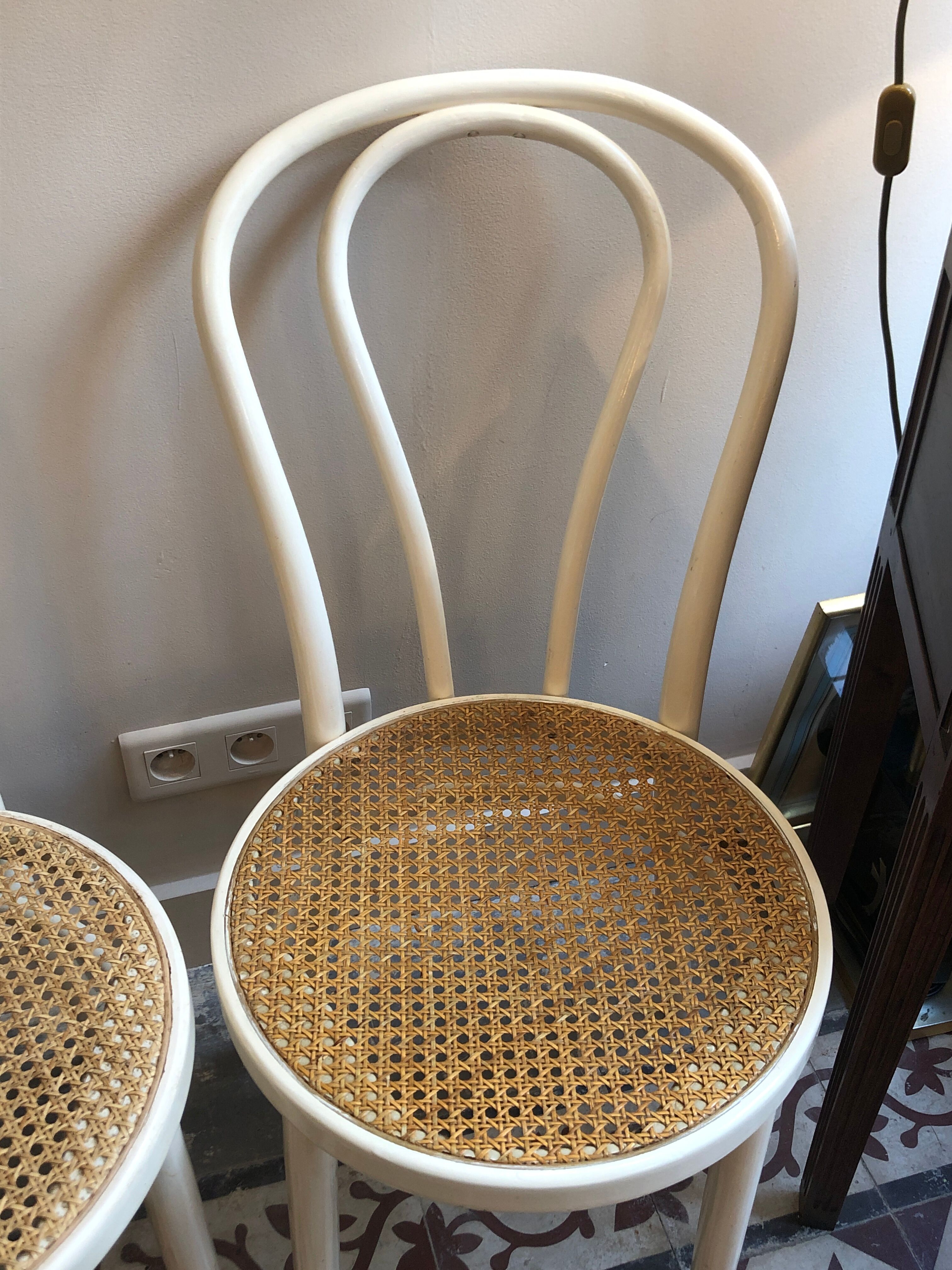 Couple of white bistro chairs