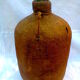 Demijohn dressed in burlap and padded cork