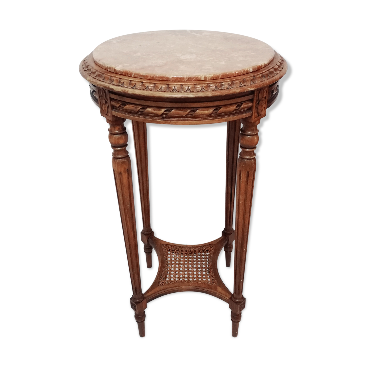 Wooden pedestal table carved in the Louis XVI style