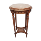 Wooden pedestal table carved in the Louis XVI style