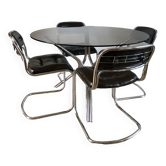 Set consisting of a table in chrome and smoked glass and its 4 tubular chairs in chrome and skaï a