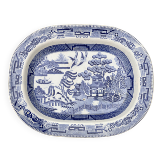 Large oval dish in blue and white English earthenware with Asian decoration, 19th century.
