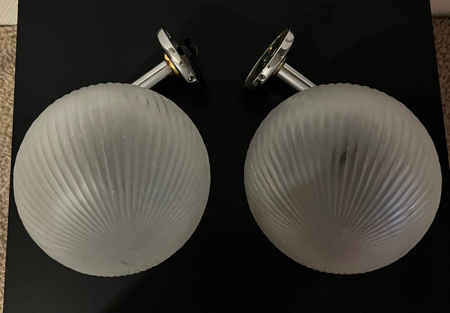 Pair of Inda metal and chiseled glass wall lights