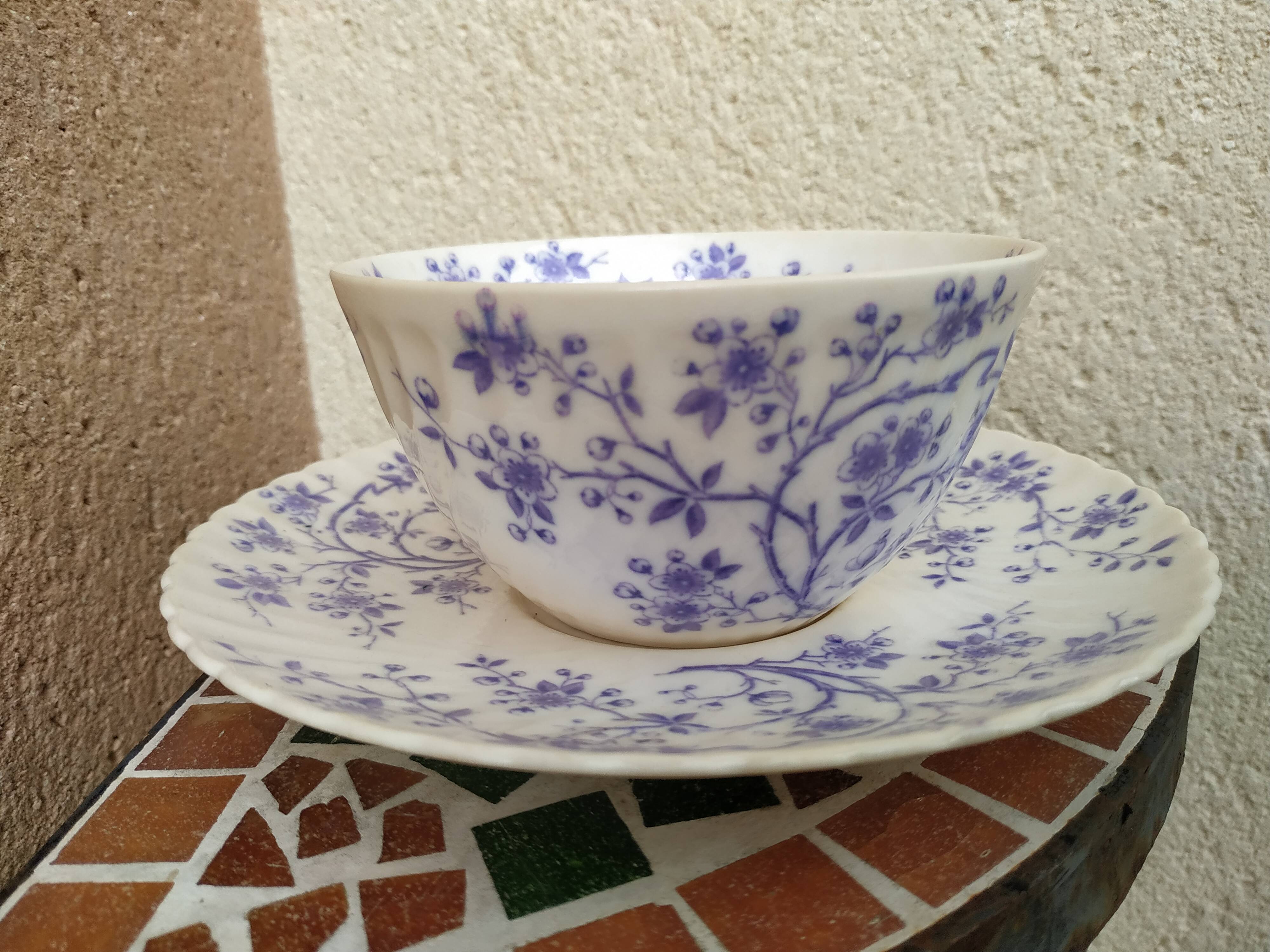 Ancient porcelain cup from eastern France with Mauve Fleurettes