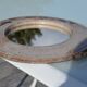 Round ceramic mirror signed