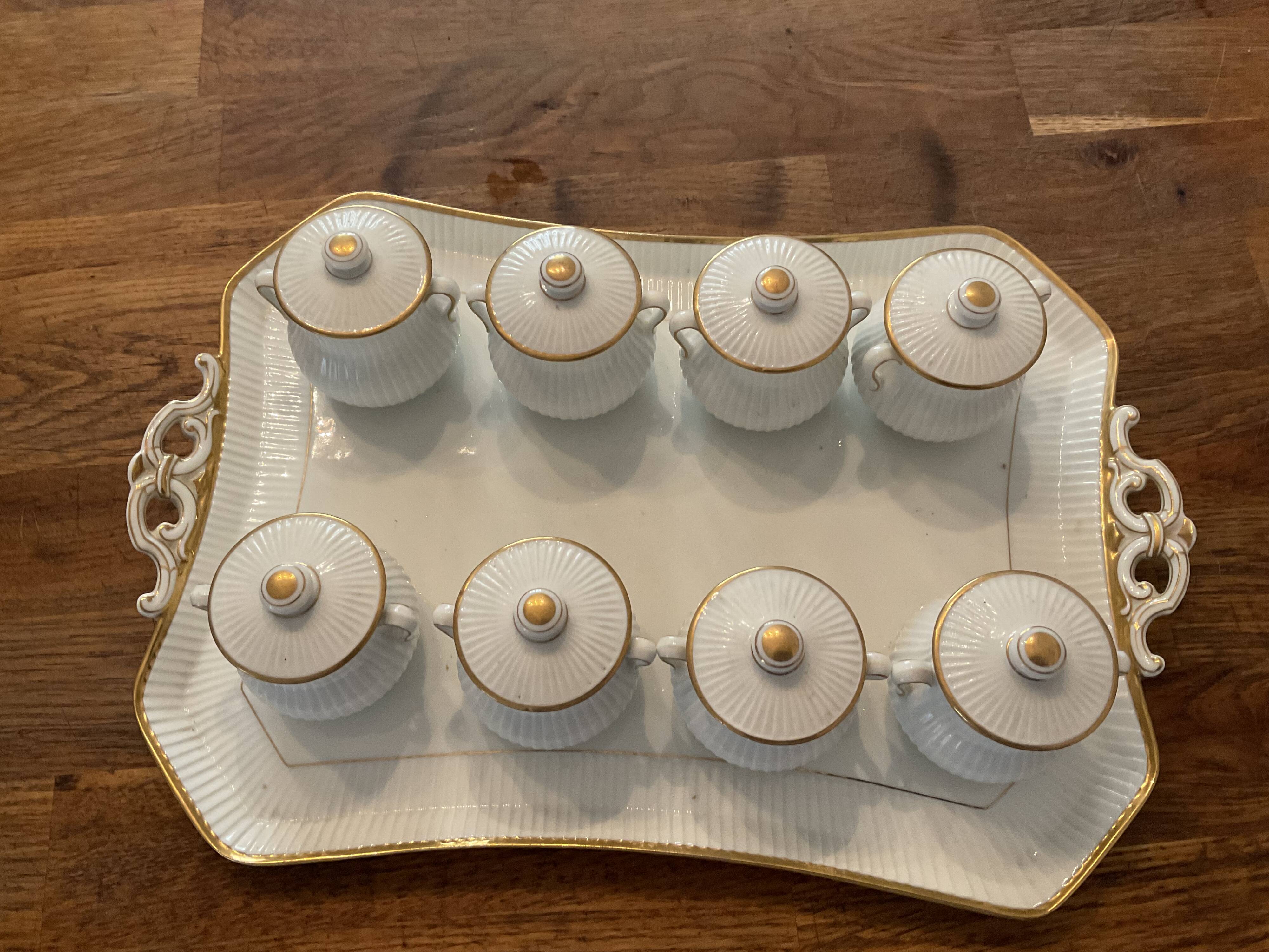 Porcelain tray and 8 matching cream pots. Antique