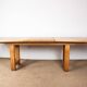 Large extendable dining table in solid oak by Guillerme and Chambron.