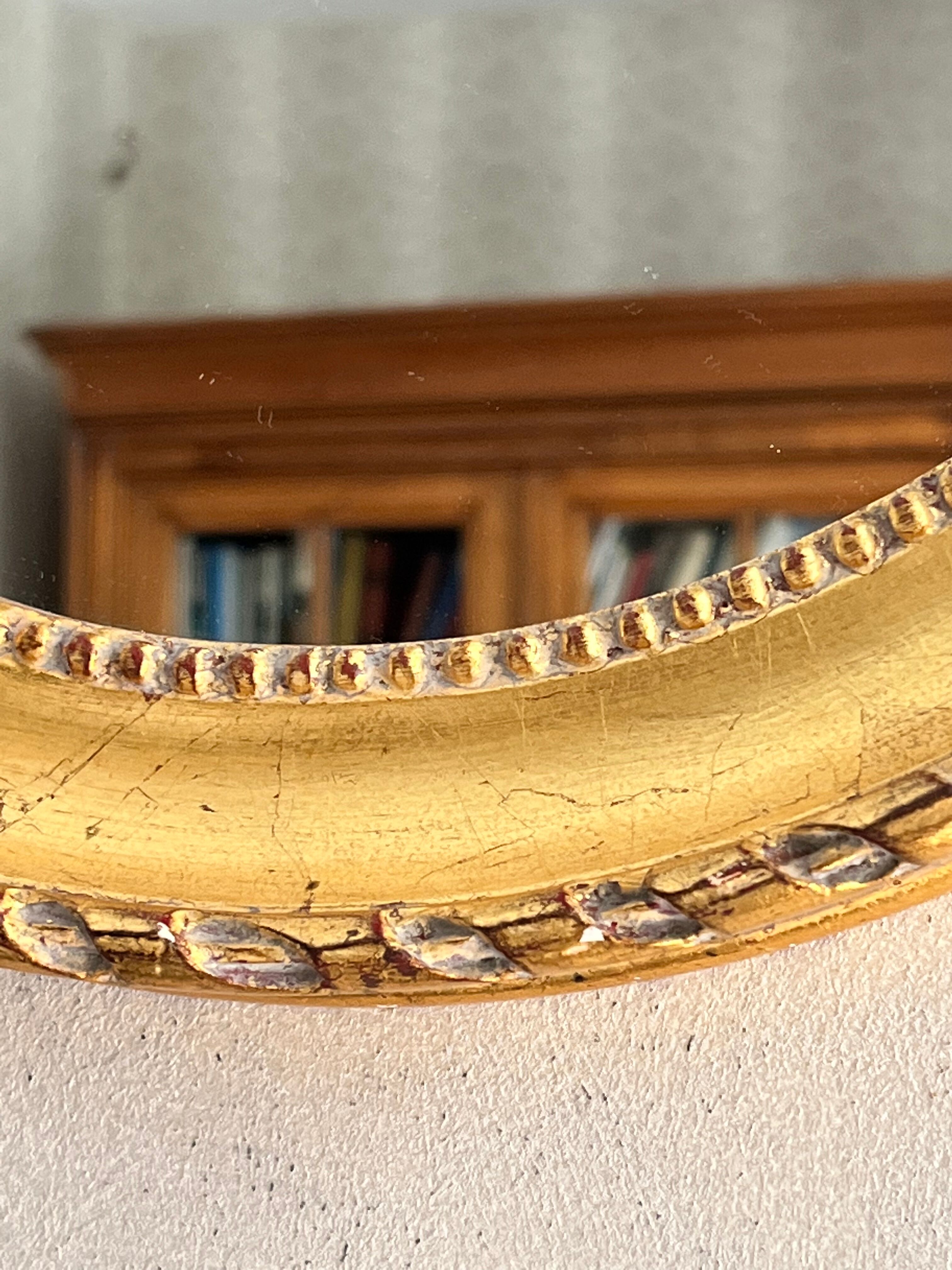 Gilded mirror with pediment