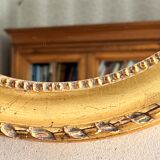 Gilded mirror with pediment