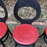 6 vintage Baumann seagull model chairs, black lacquered with red Skai seats.