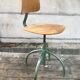 Former green metal workshop chair