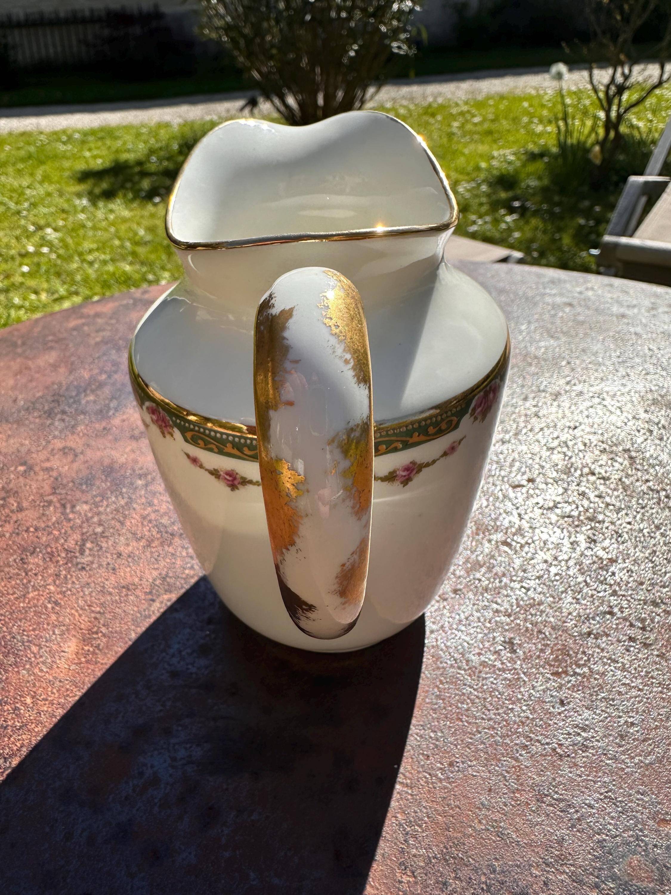 Set of jug, sugar bowl, and milk jug in Limoges porcelain by Paul Past.