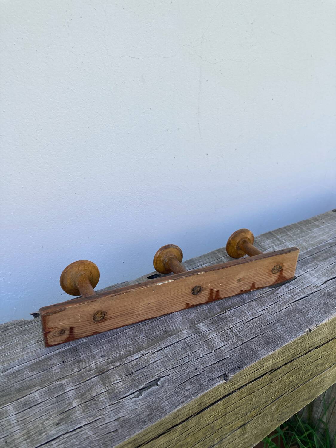 Old wooden wall coat rack