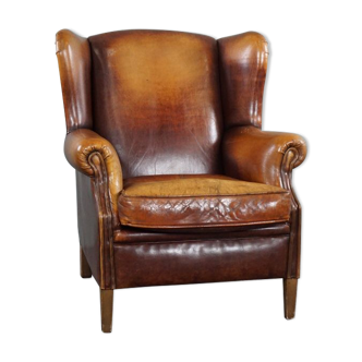 Armchair in patinated sheepskin leather
