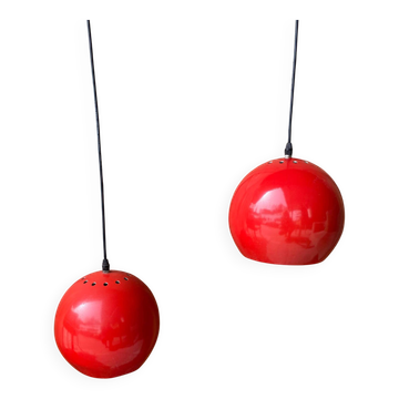 Pair of red metal ball pendant lights from the 1970s.