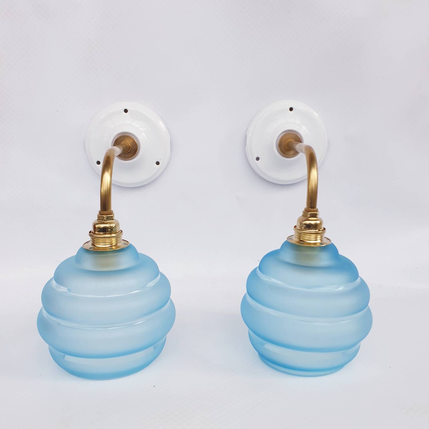 Vintage brass and blue glass wall lights