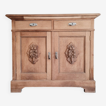 Old buffet in raw wood with carved medallion doors