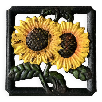 Cast iron trivet with sunflower decor