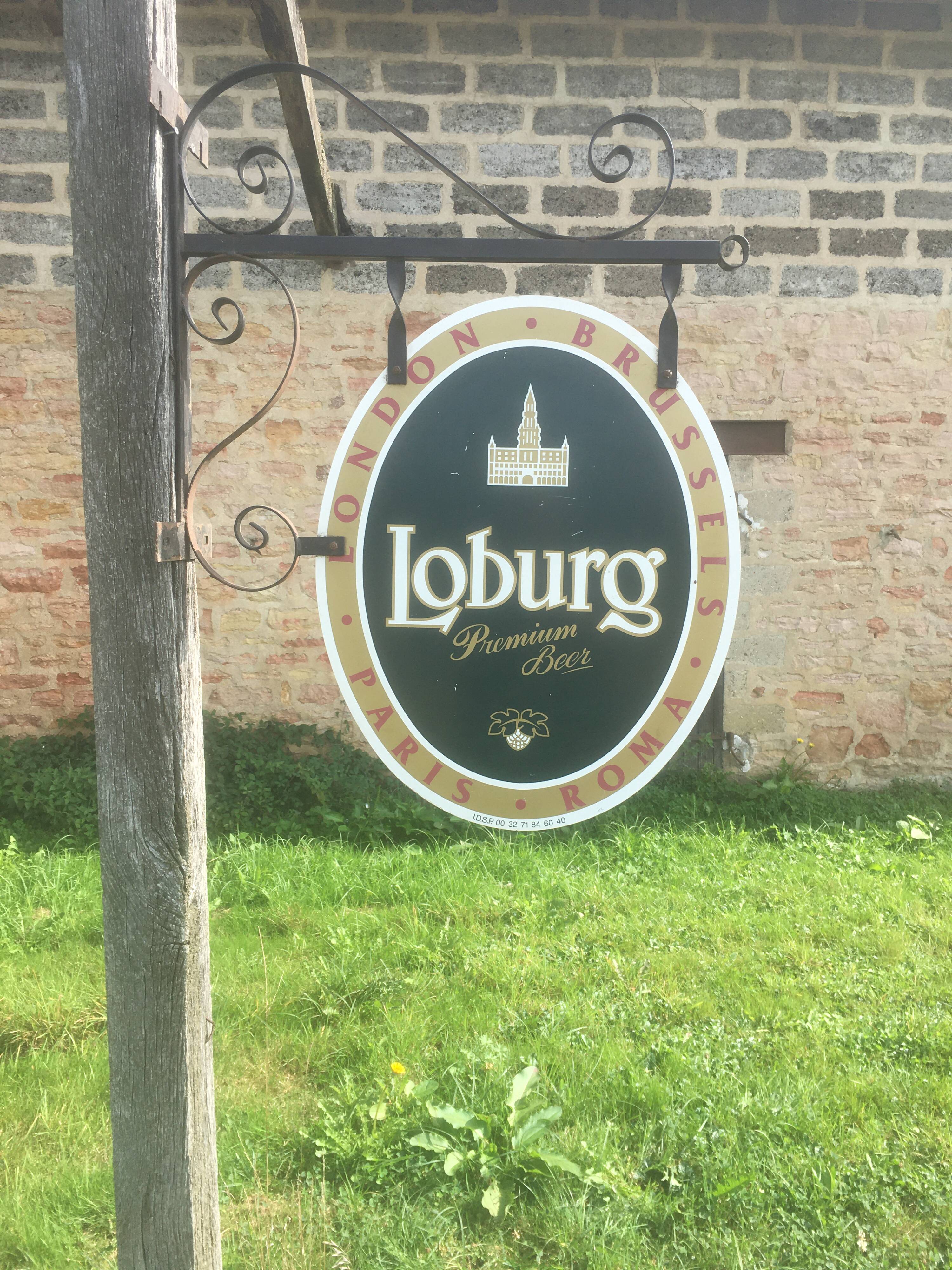Double-sided "Loburg Beer" metal sign on wrought iron bracket