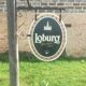 Double-sided "Loburg Beer" metal sign on wrought iron bracket