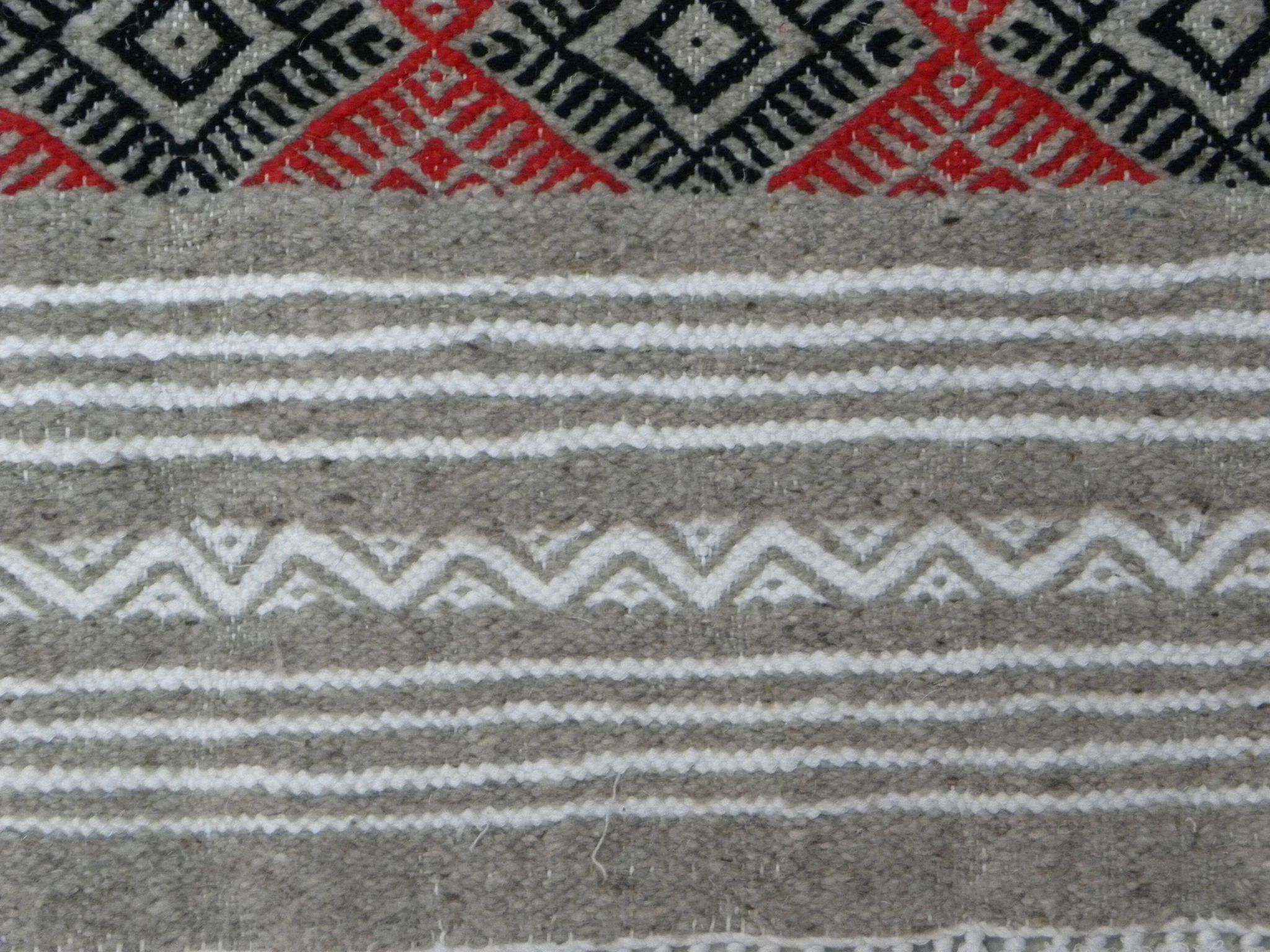 Geometric woven rug with fringes – Ethnic style – Hallway & interior