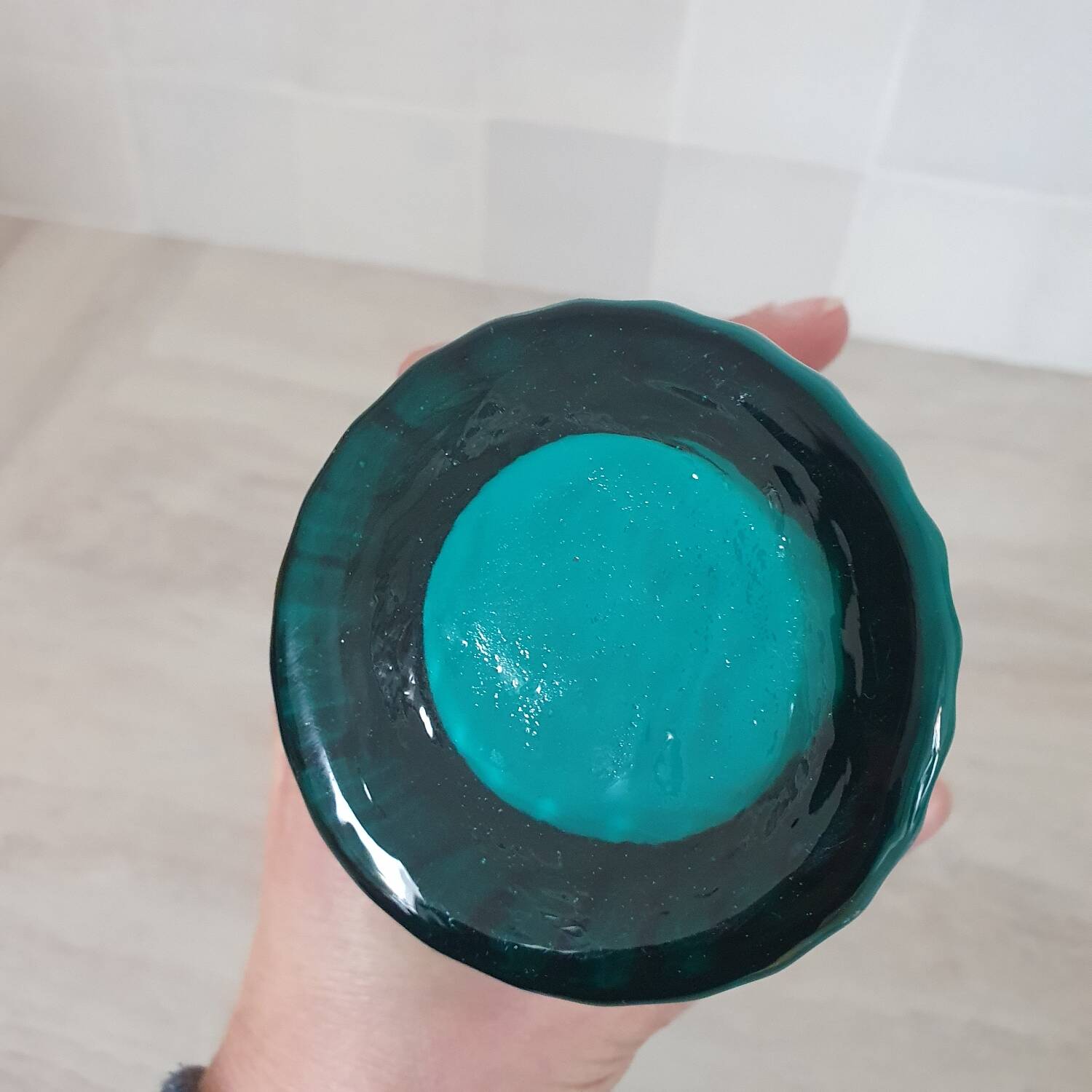 Curved turquoise blue blown glass soliflore vase