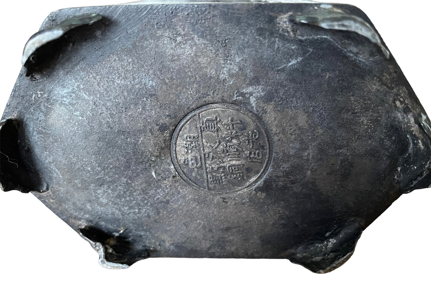 Ancient Asian teapot made of pewter and glass