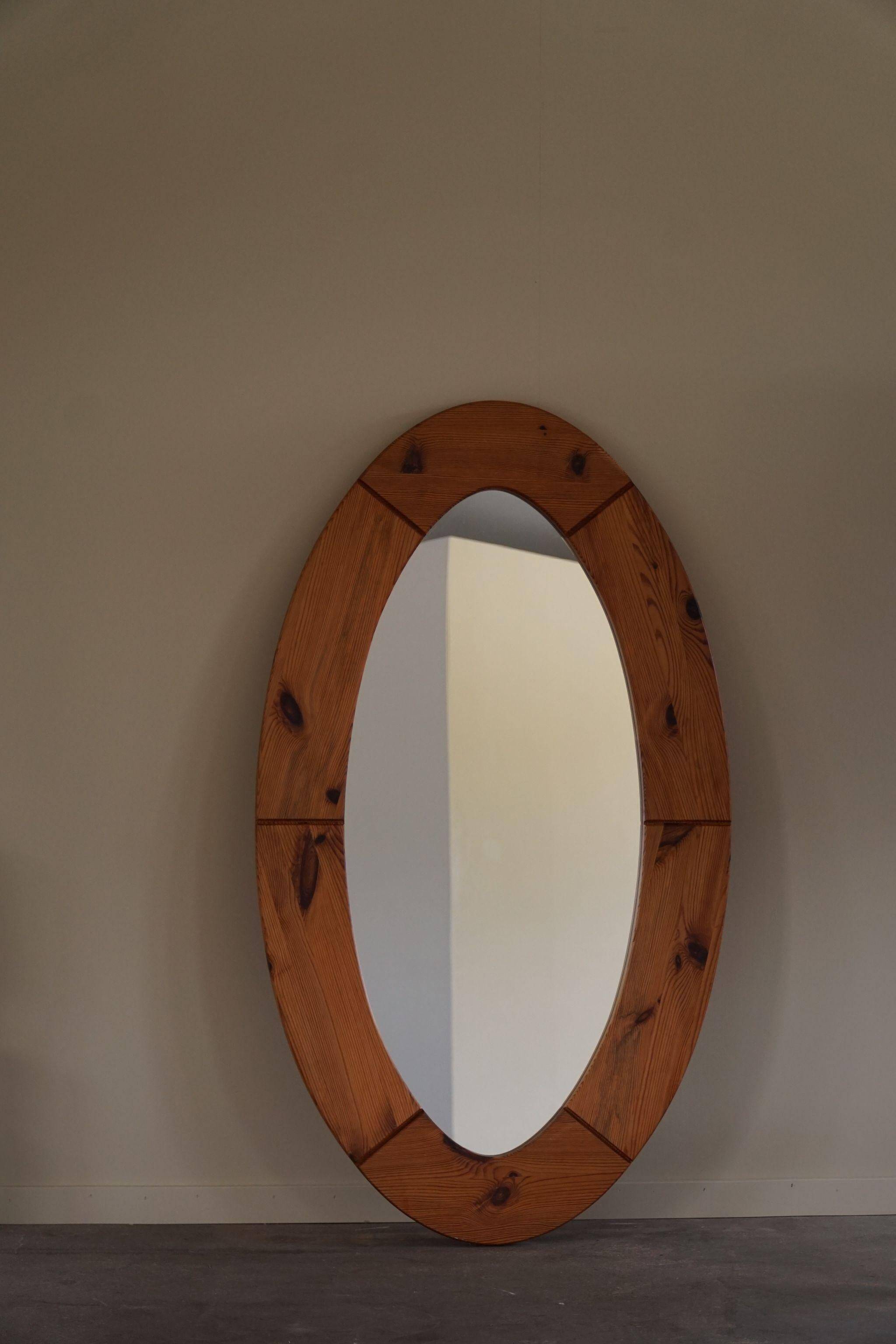 Large oval wall mirror in solid pine by Glasmäster Markaryd, Sweden, 1960s.