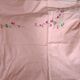 Nappe rose avec couronne de fleurs + 10 serviettes