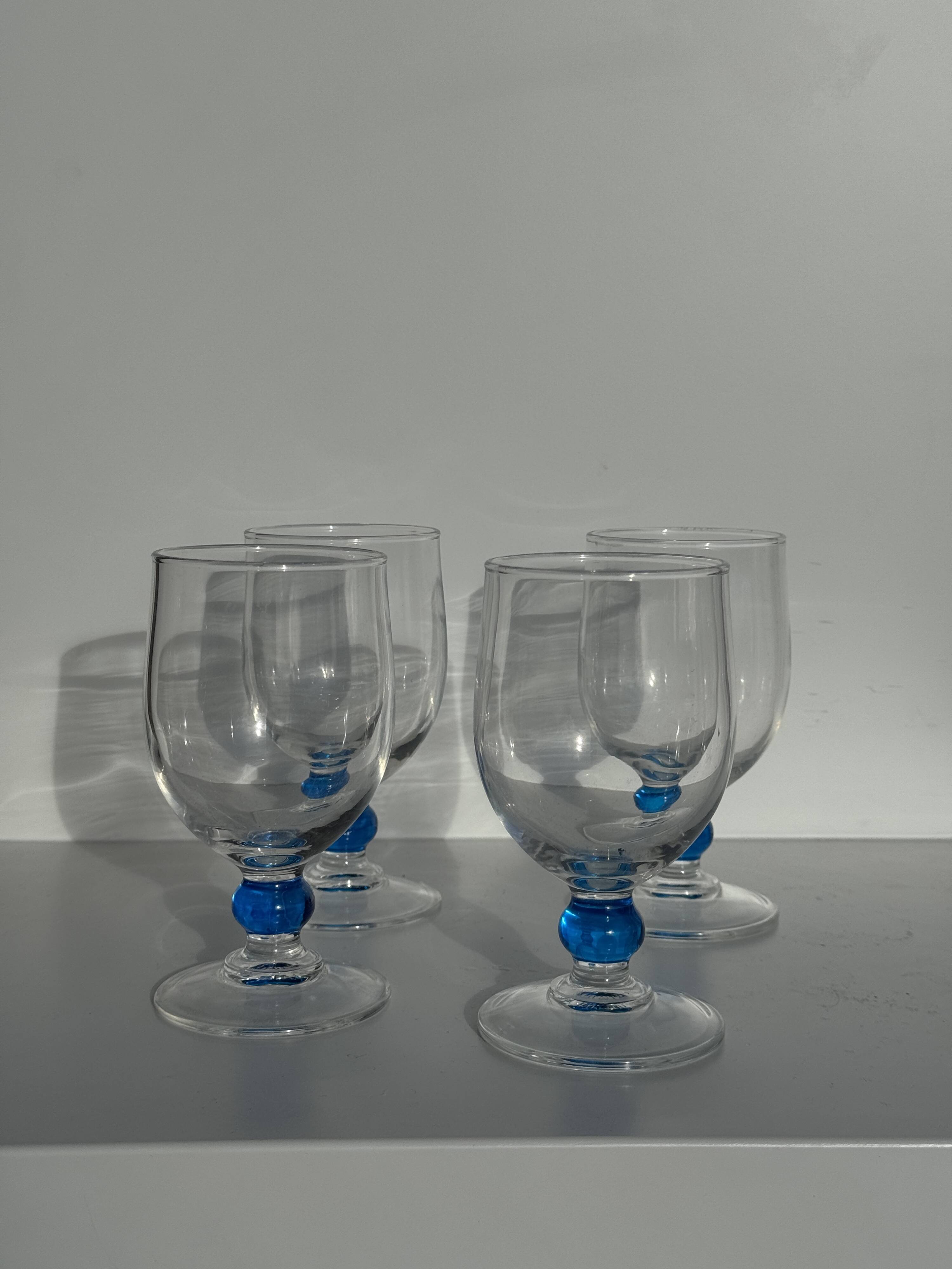Set of 4 blue ball stemmed water glasses