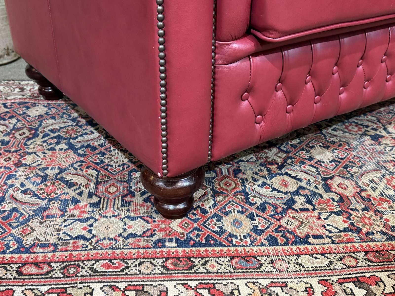 Chesterfield 2-seater leather sofa, modern production from the 2000s.