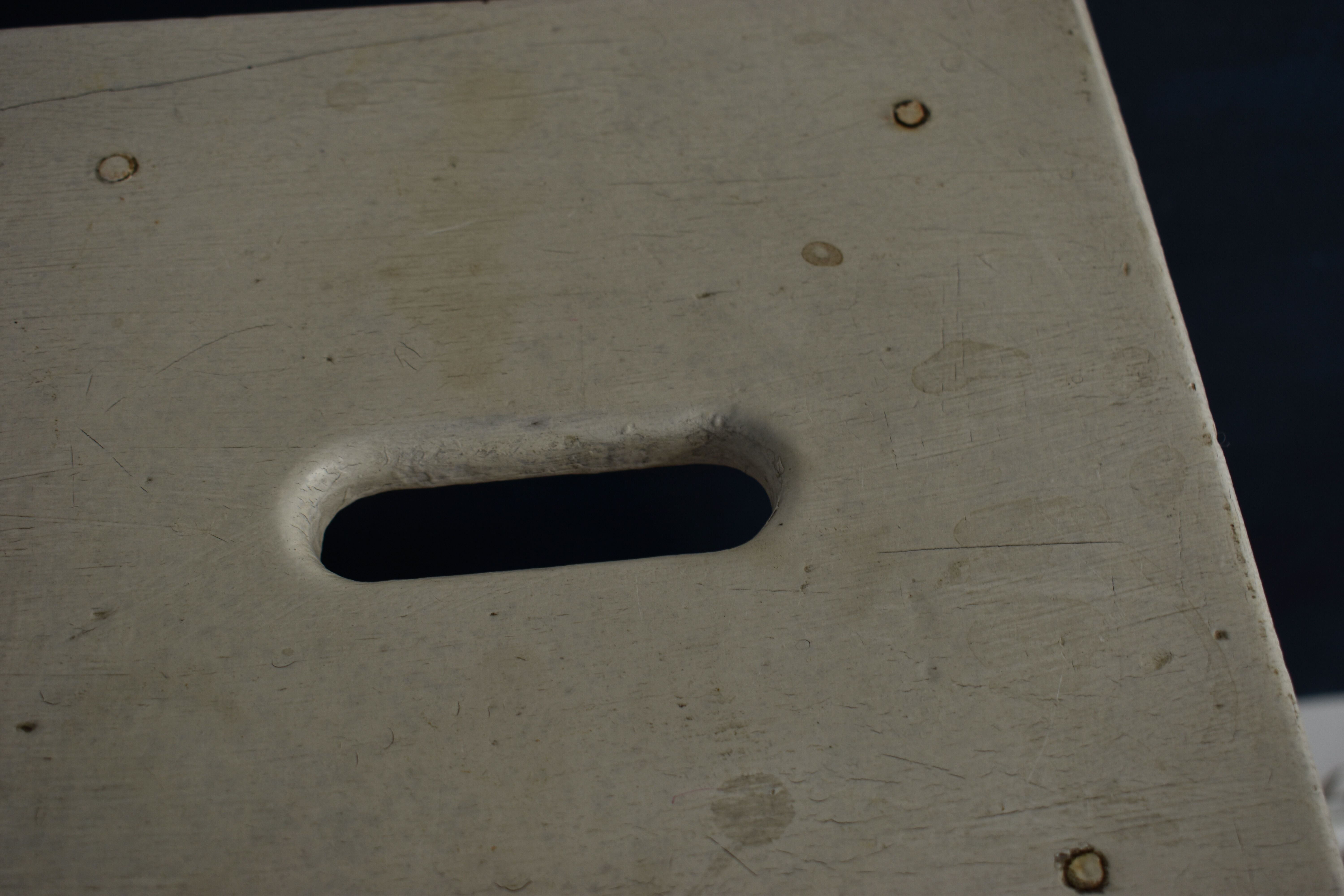 Old white wooden handle stool