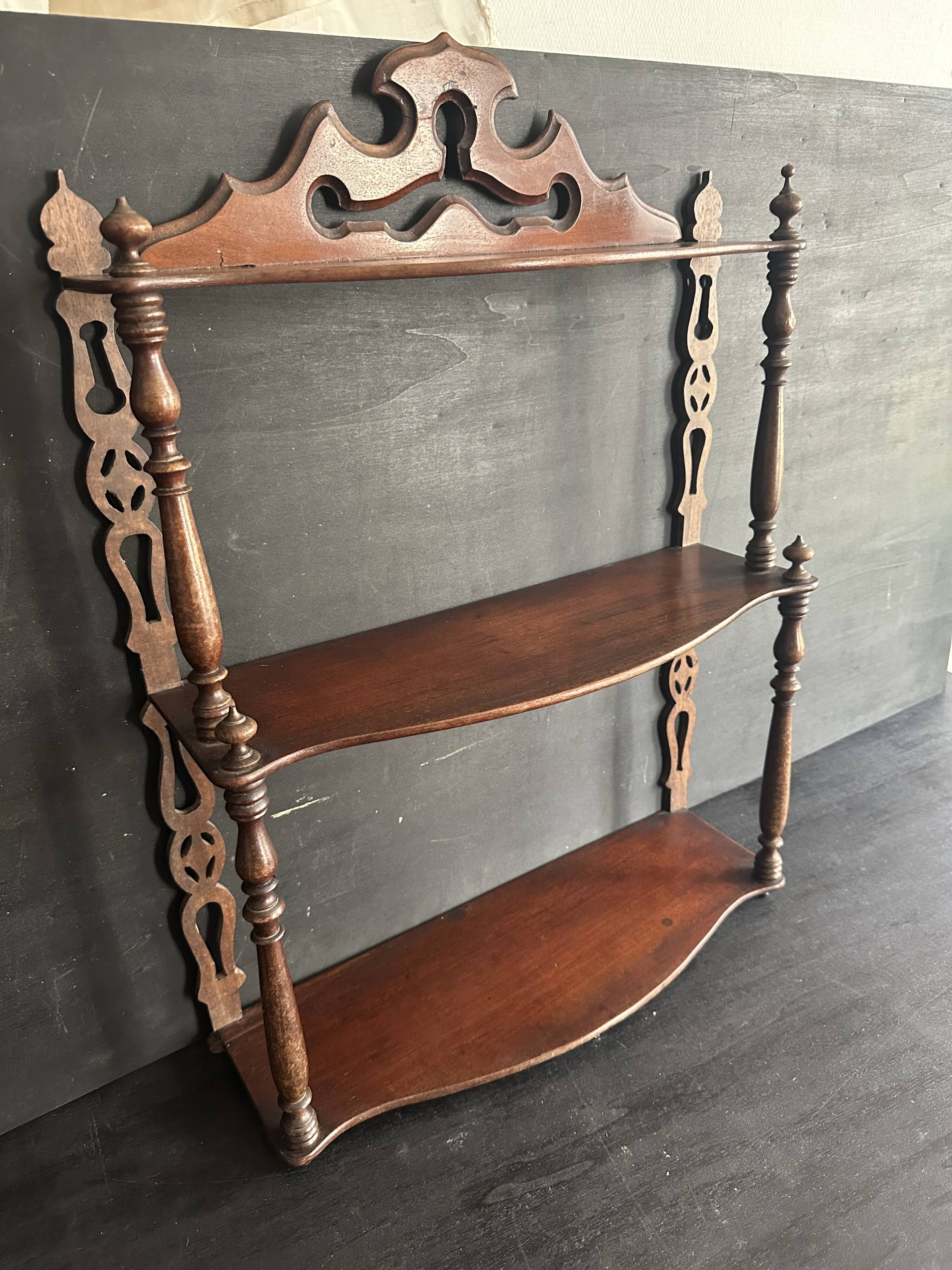 Napoleon III wall shelf in turned wood with a pediment.