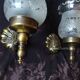 Pair of wall sconces in bronze with opaline glass tulips.