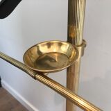 Neoclassical style valet stand in brass and black lacquered wood. French work. Circa 1940