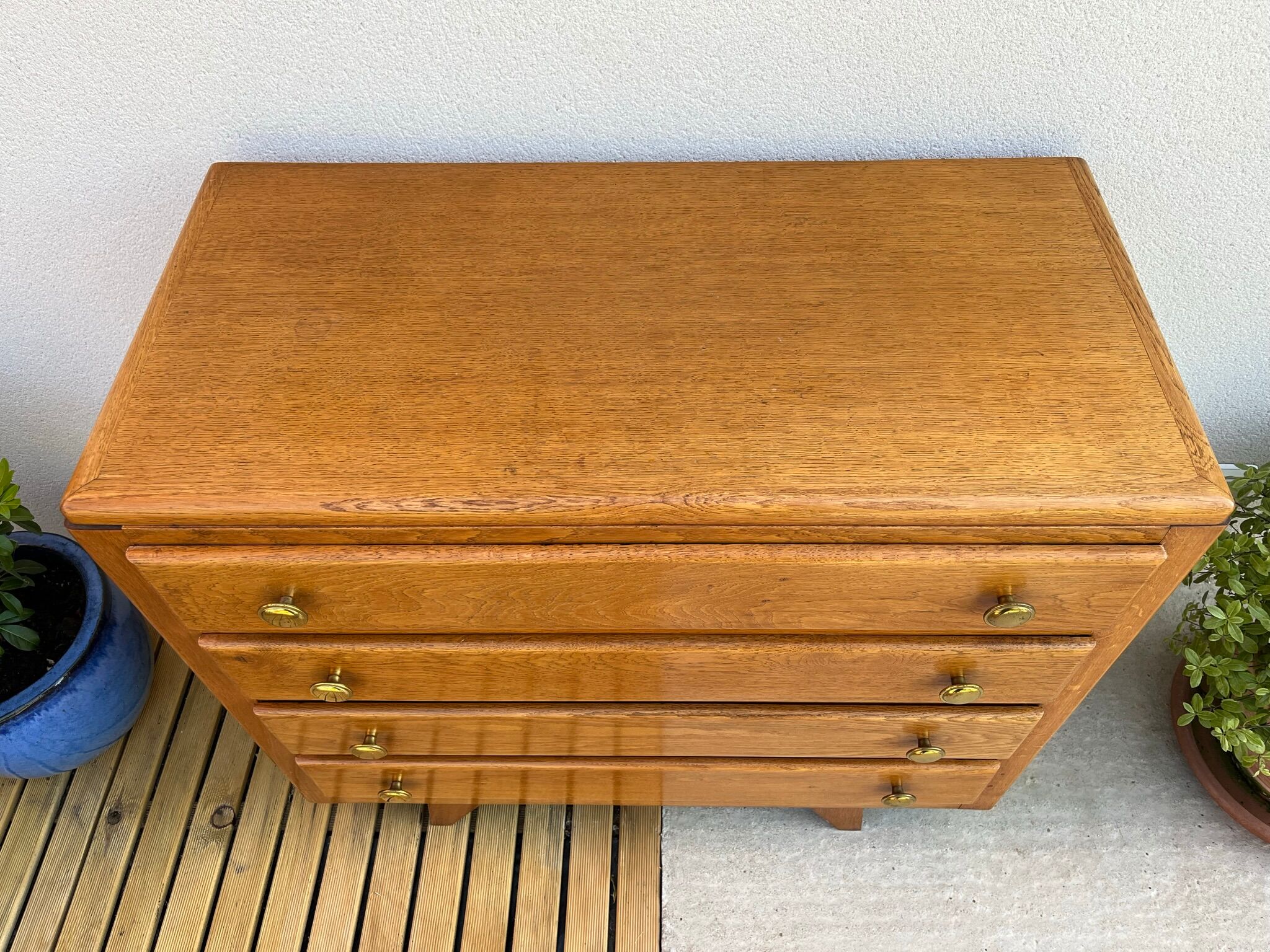 Oak art deco chest of drawers, compass legs