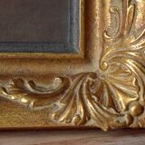 Old large wall frame in gilded carved wood
