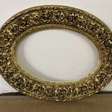 Large format golden oval frame