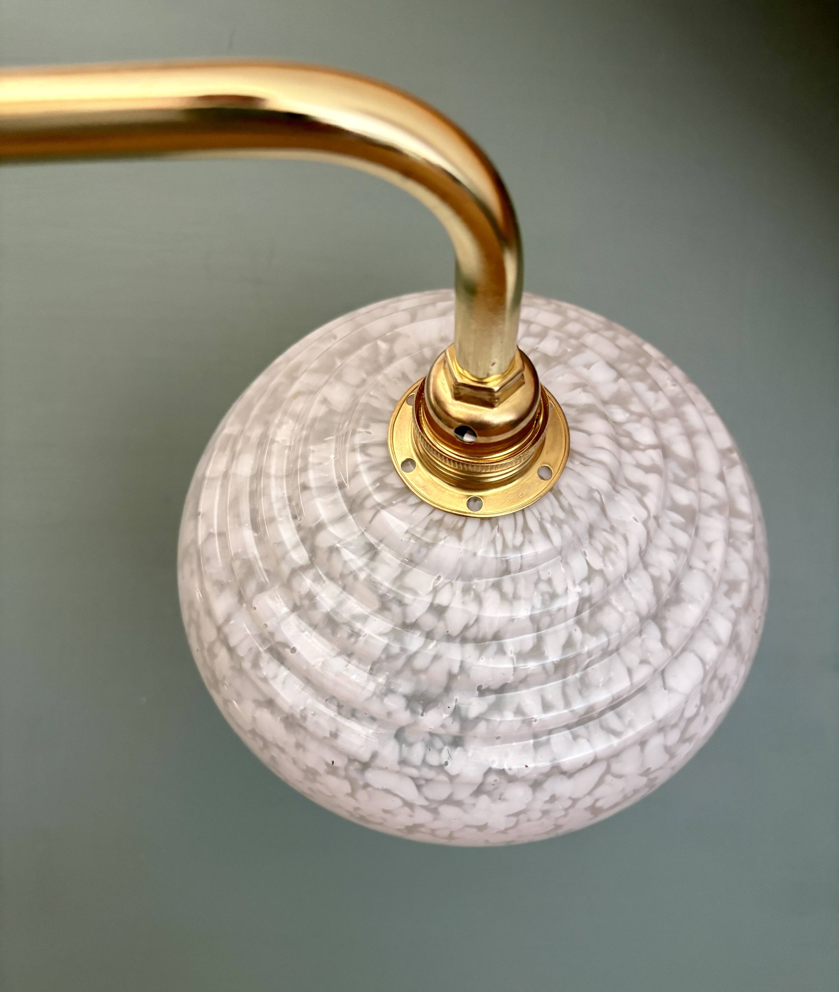 Vintage glass wall lamp with a white Clichy shade.