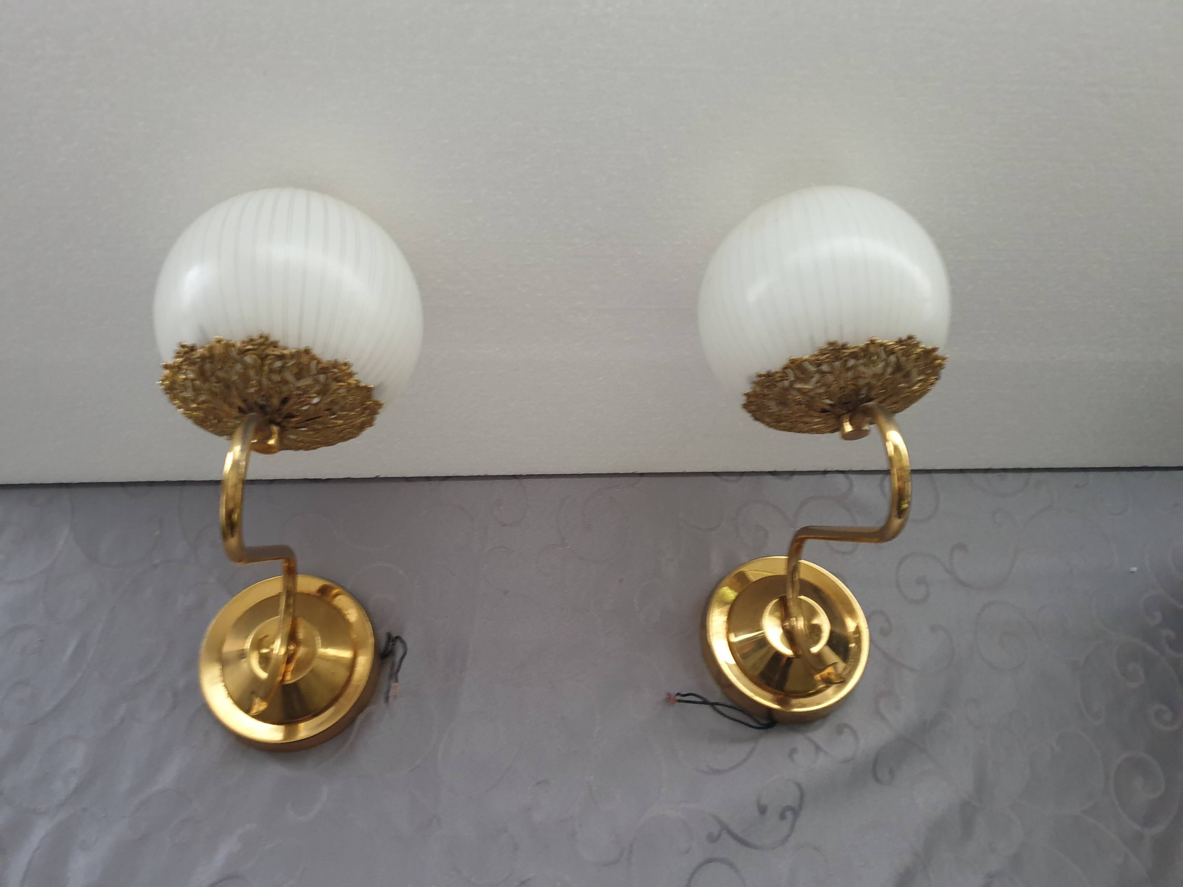 Pair of brass and glass wall lights