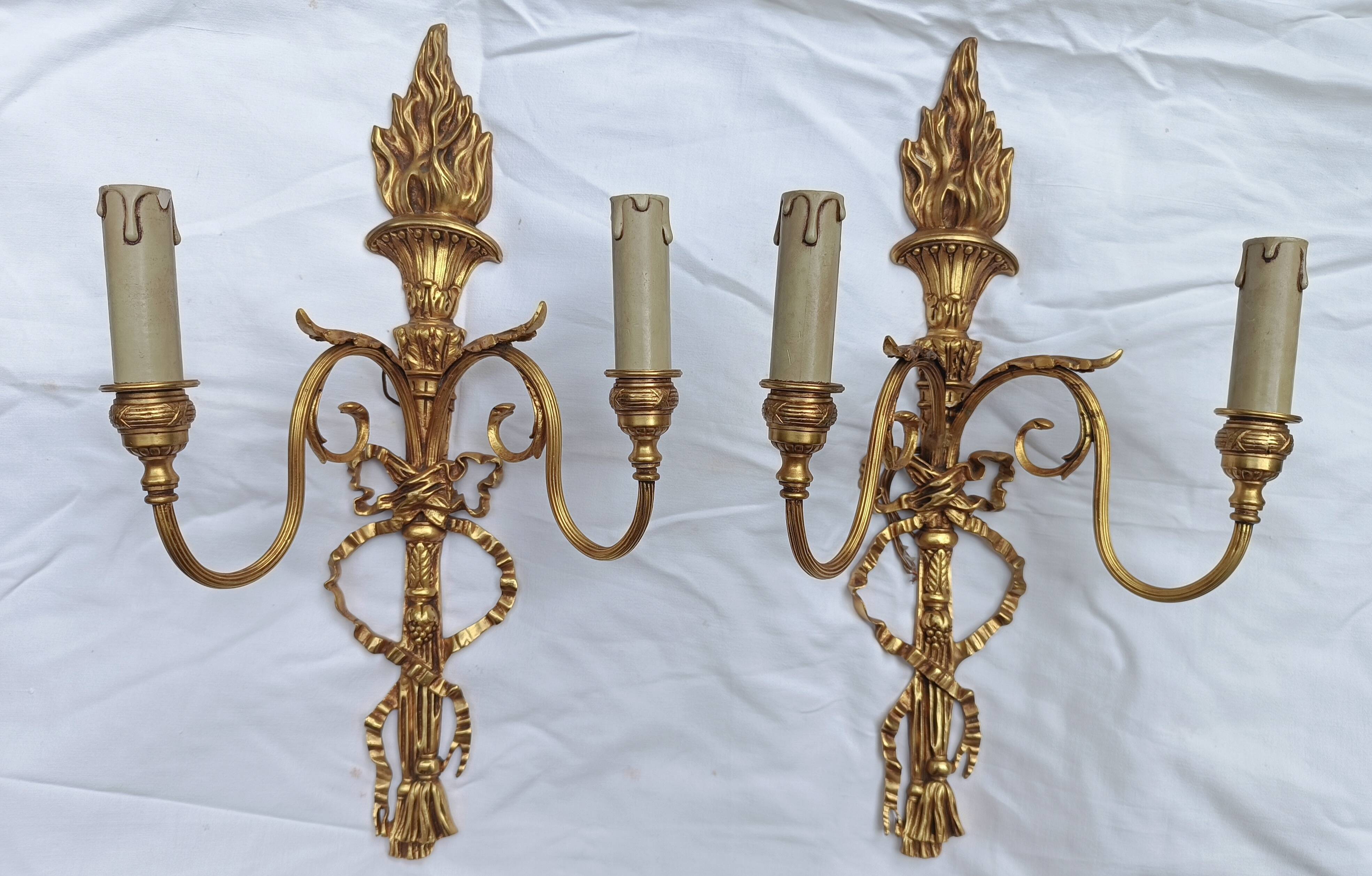 Pair of "torch" wall sconces Louis XVI in gilded bronze